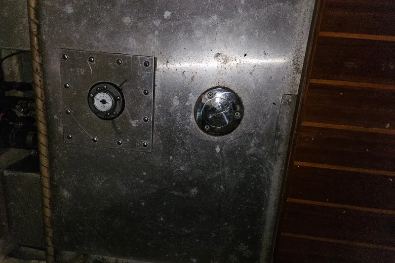 Slide: The Image of Metallic panel with gauge and valve on 1989 Pacific Seacraft 37 yacht. - 42