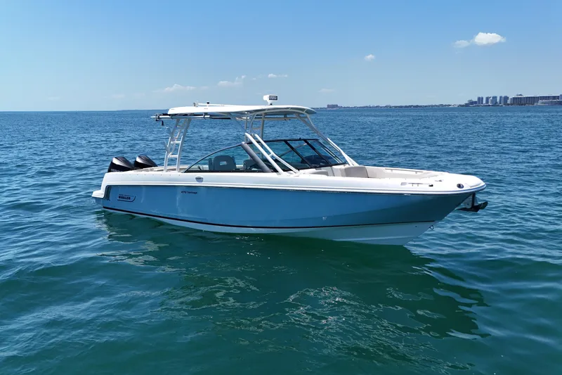 The Image of 2019 Boston Whaler 270 Vantage boat on open water under clear blue sky. - 0
