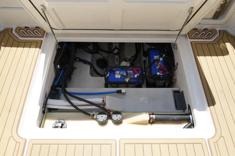 Slide: The Image of 2019 Boston Whaler 270 Vantage engine compartment with batteries and wiring. - 22