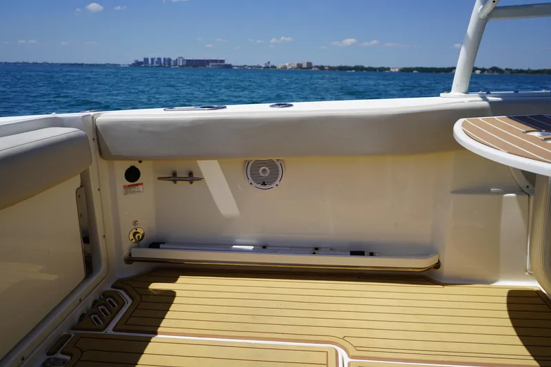 Slide: The Image of 2019 Boston Whaler 270 Vantage interior with ocean view and teak flooring. - 23