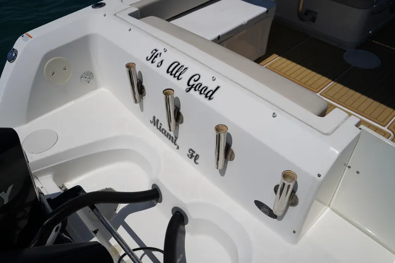 Slide: The Image of 2019 Boston Whaler 270 Vantage boat deck with rod holders, "It's All Good" text. - 24