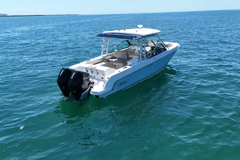 Slide: The Image of 2019 Boston Whaler 270 Vantage boat on open water, featuring dual engines. - 3