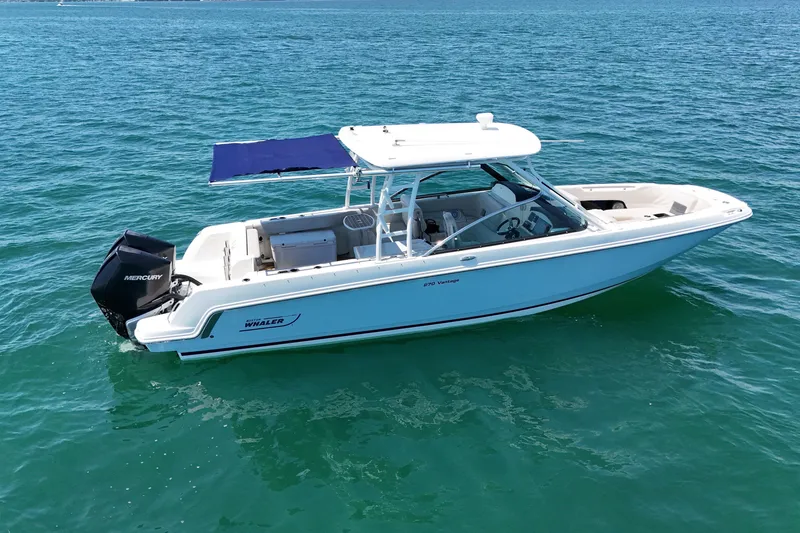 Slide: The Image of 2019 Boston Whaler 270 Vantage boat on clear blue water. - 6