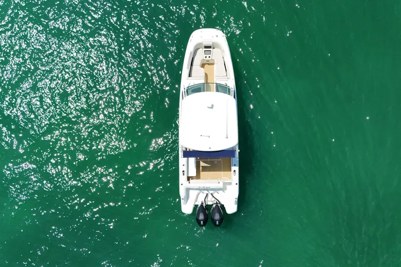 Slide: The Image of Aerial view of 2019 Boston Whaler 270 Vantage on sparkling green water. - 8