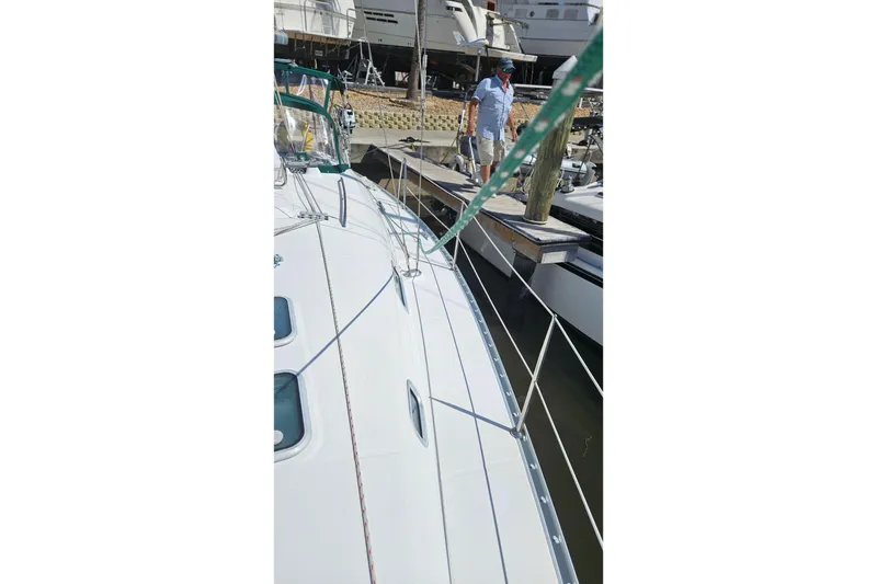 Slide: The Image of Beneteau Oceanis Clipper 361 sailboat, 2000 model, docked with clear blue sky background. - 10