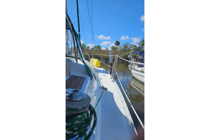 Slide: The Image of Cockpit view of 2000 Beneteau Oceanis Clipper 361 sailboat with green canopy. - 13