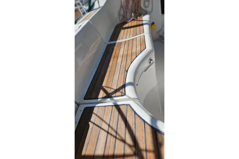 Slide: The Image of Beneteau Oceanis Clipper 361, 2000 model, featuring teak deck seating area. - 17