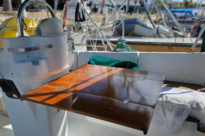 Slide: The Image of Control panel of a 2000 Beneteau Oceanis Clipper 361 sailboat, featuring gauges and switches. - 23