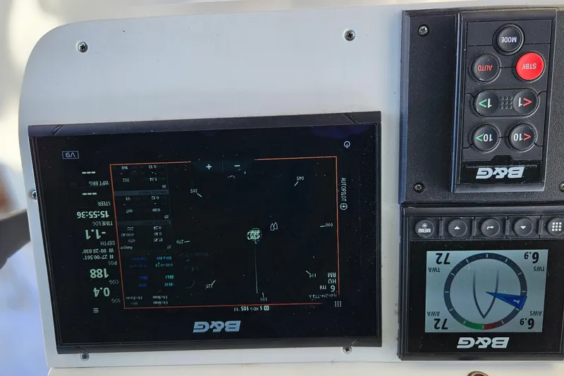 Slide: The Image of Interior view of 2000 Beneteau Oceanis Clipper 361 sailboat, featuring wooden cabinetry and steps. - 24