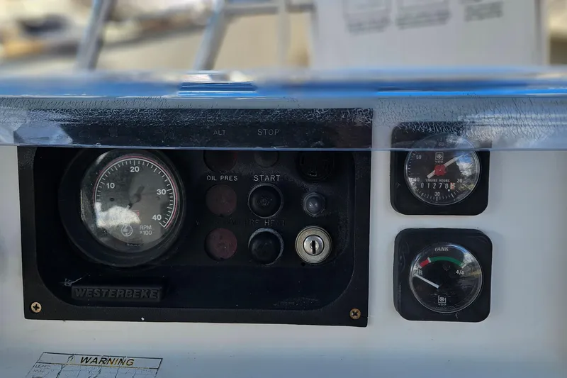 Slide: The Image of Interior of 2000 Beneteau Oceanis Clipper 361 yacht with wood finish and seating area. - 25