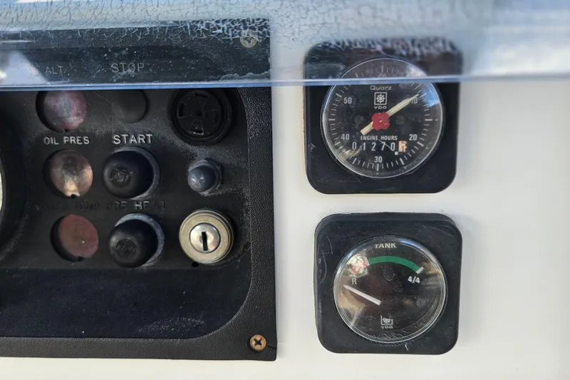 Slide: The Image of Interior of 2000 Beneteau Oceanis Clipper 361 yacht with wooden finish and blue seating. - 26