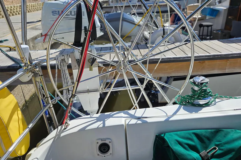 Slide: The Image of Interior of 2000 Beneteau Oceanis Clipper 361 yacht with wooden finish and blue seating. - 27