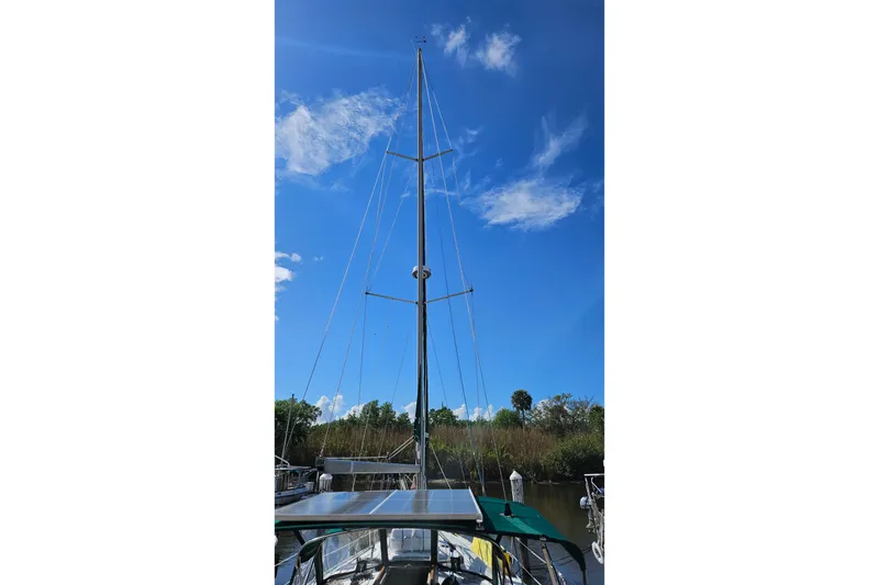 Slide: The Image of Sailboat mast of 2000 Beneteau Oceanis Clipper 361 under clear blue sky. - 3