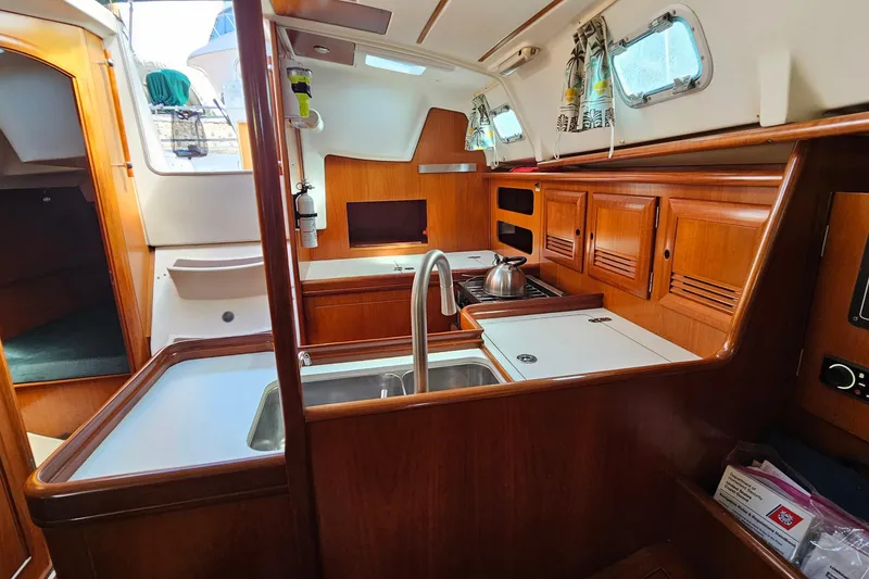 Slide: The Image of Control panel of a 2000 Beneteau Oceanis Clipper 361 sailboat, featuring navigation equipment. - 35