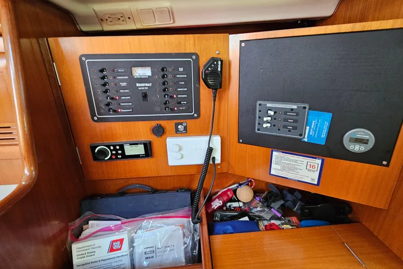 Slide: The Image of Interior cabin of 2000 Beneteau Oceanis Clipper 361 with wooden cabinetry and blue cushions. - 39