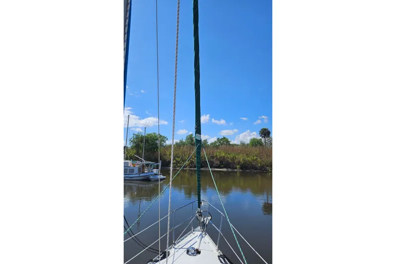 Slide: The Image of Bow view of 2000 Beneteau Oceanis Clipper 361 sailboat on calm water. - 4