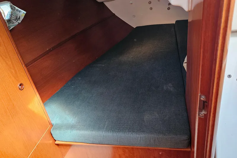 Slide: The Image of Interior view of a 2000 Beneteau Oceanis Clipper 361 sailboat, showcasing floor and wood details. - 41