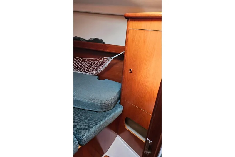 Slide: The Image of Beneteau Oceanis Clipper 361 yacht interior, featuring a sleek wooden countertop, 2000 model. - 44