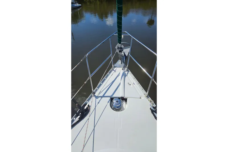 Slide: The Image of Anchor chain and windlass on a 2000 Beneteau Oceanis Clipper 361 sailboat. - 5