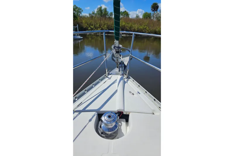 Slide: The Image of Beneteau Oceanis Clipper 361 sailboat deck with yellow fuel containers, docked at marina. - 6