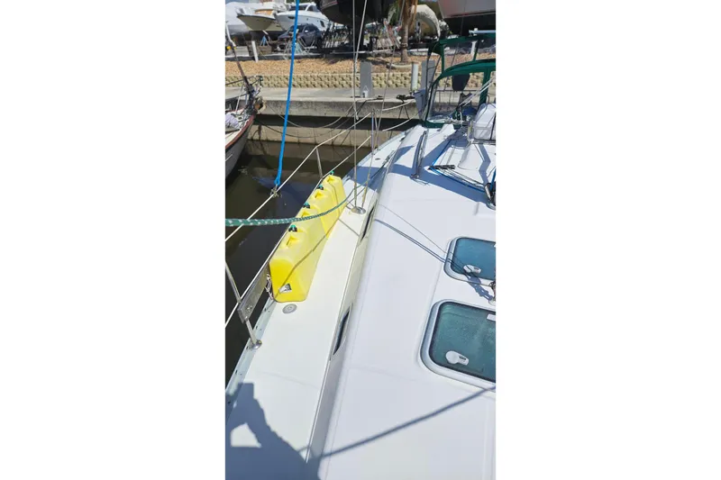 Slide: The Image of Beneteau Oceanis Clipper 361 sailboat docked, 2000 model, with person on deck. - 8