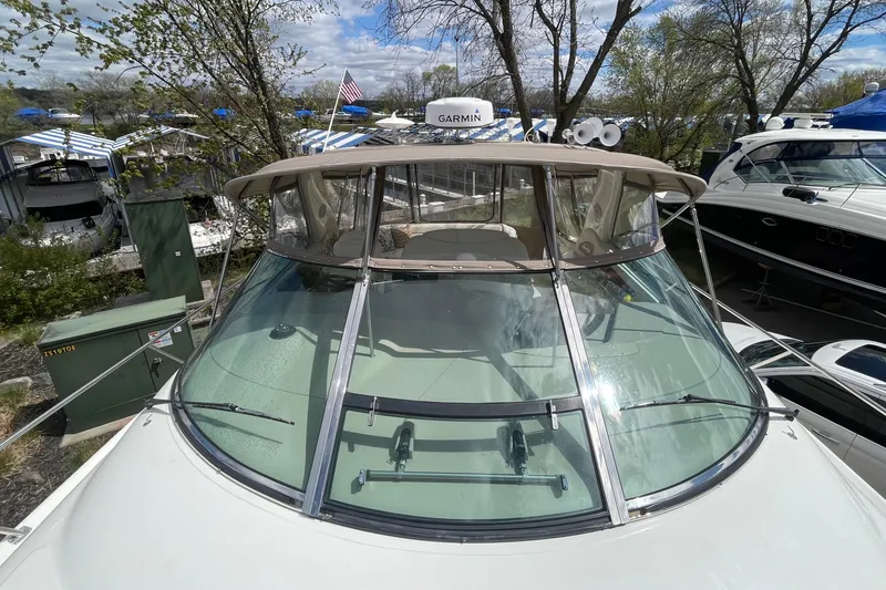 Slide: The Image of 2000 Sea Ray Sundancer 460 yacht with Garmin equipment, docked in a marina. - 23