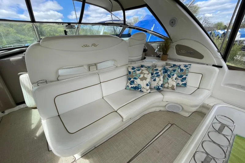 Slide: The Image of Interior of 2000 Sea Ray Sundancer 460 yacht with white seating and table. - 26