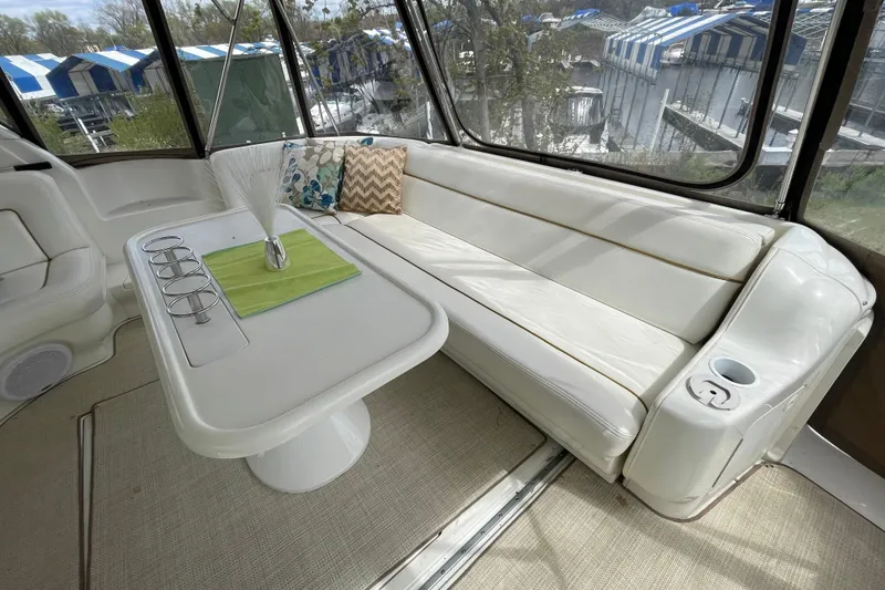 Slide: The Image of Luxurious interior of 2000 Sea Ray Sundancer 460 yacht with plush seating and decorative pillows. - 27