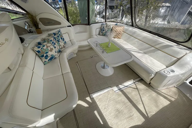 Slide: The Image of Interior of 2000 Sea Ray Sundancer 460 yacht with plush seating and panoramic windows. - 28