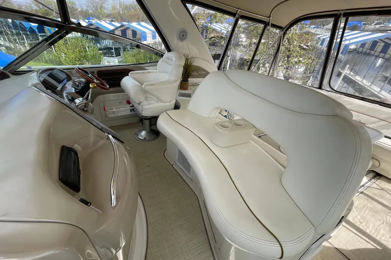 Slide: The Image of Luxurious interior of 2000 Sea Ray Sundancer 460 yacht with plush seating and helm. - 29