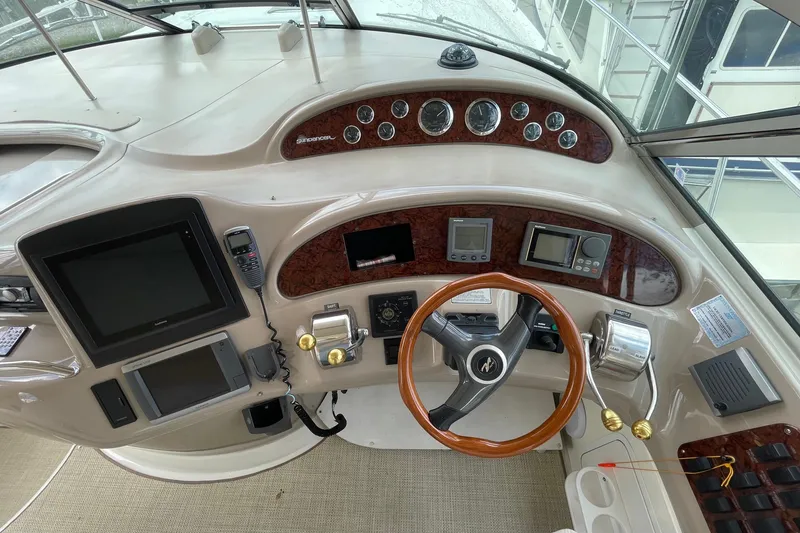 Slide: The Image of Luxurious interior of 2000 Sea Ray Sundancer 460 yacht with plush seating and scenic views. - 31