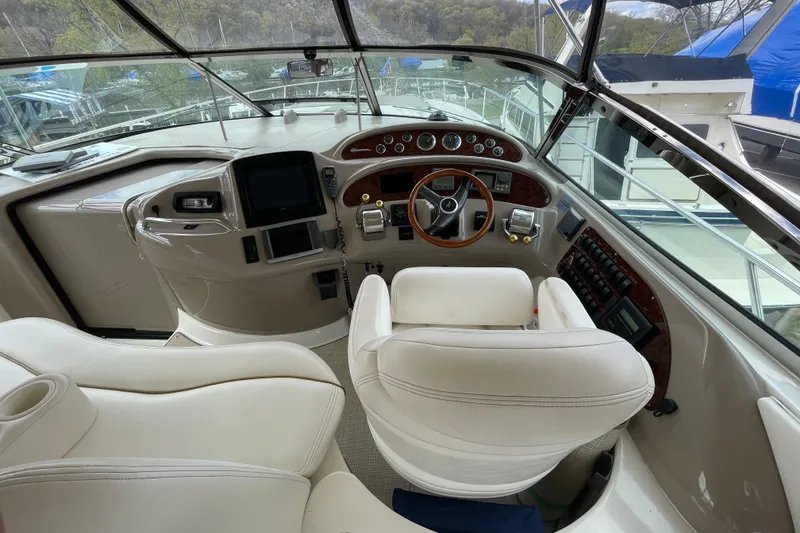 Slide: The Image of Luxurious interior seating of 2000 Sea Ray Sundancer 460 yacht with cup holders. - 33