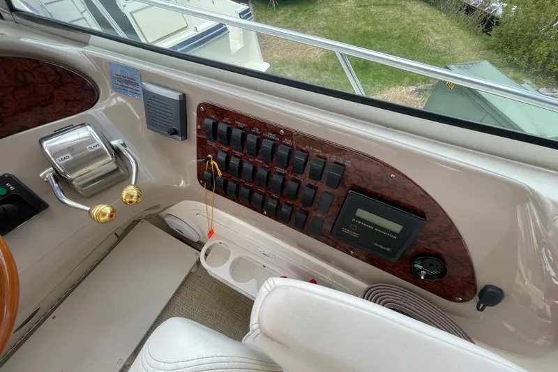 Slide: The Image of Interior cockpit of 2000 Sea Ray Sundancer 460 yacht with steering wheel and controls. - 34