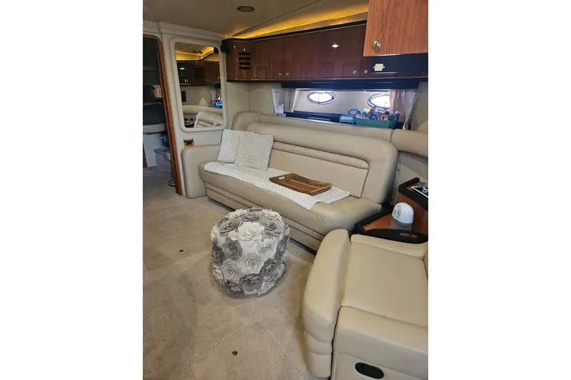 Slide: The Image of Luxurious interior of 2000 Sea Ray Sundancer 460 yacht with beige seating and elegant decor. - 4