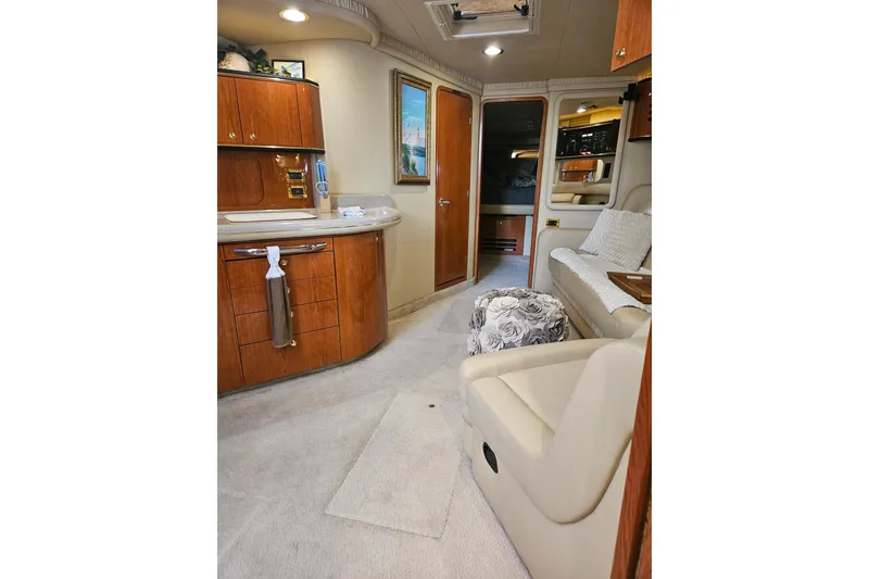 Slide: The Image of Luxurious interior of 2000 Sea Ray Sundancer 460 with beige leather seating and decorative pillows. - 41