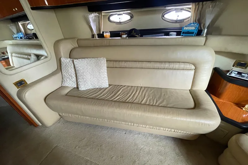 Slide: The Image of Kitchen area of a 2000 Sea Ray Sundancer 460 yacht with wooden cabinetry and sink. - 45