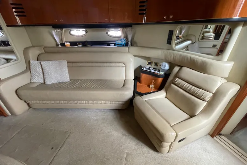 Slide: The Image of Interior of 2000 Sea Ray Sundancer 460 yacht with beige leather seating and decorative pillows. - 46