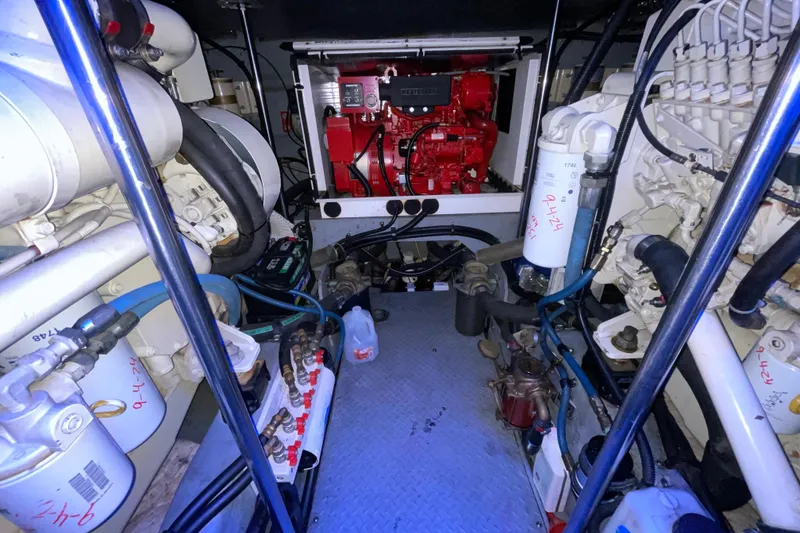 Slide: The Image of Engine room of a 2000 Sea Ray Sundancer 460 with a red Westerbeke generator. - 52
