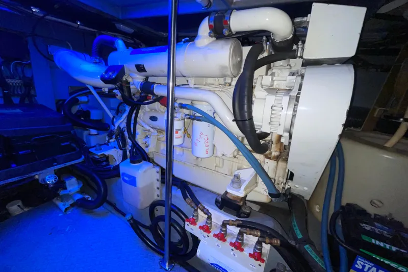 Slide: The Image of Engine room of a 2000 Sea Ray Sundancer 460 yacht, showcasing mechanical components. - 53