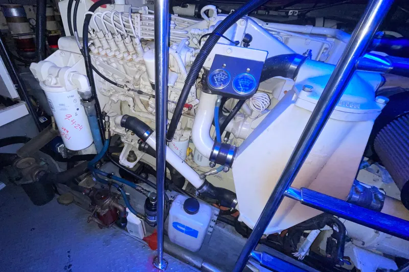 Slide: The Image of Engine room of a 2000 Sea Ray Sundancer 460 yacht, showcasing mechanical components. - 55