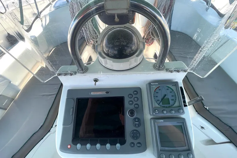 Slide: The Image of Cockpit of 2007 Beneteau 423 sailboat with navigation instruments and compass. - 15