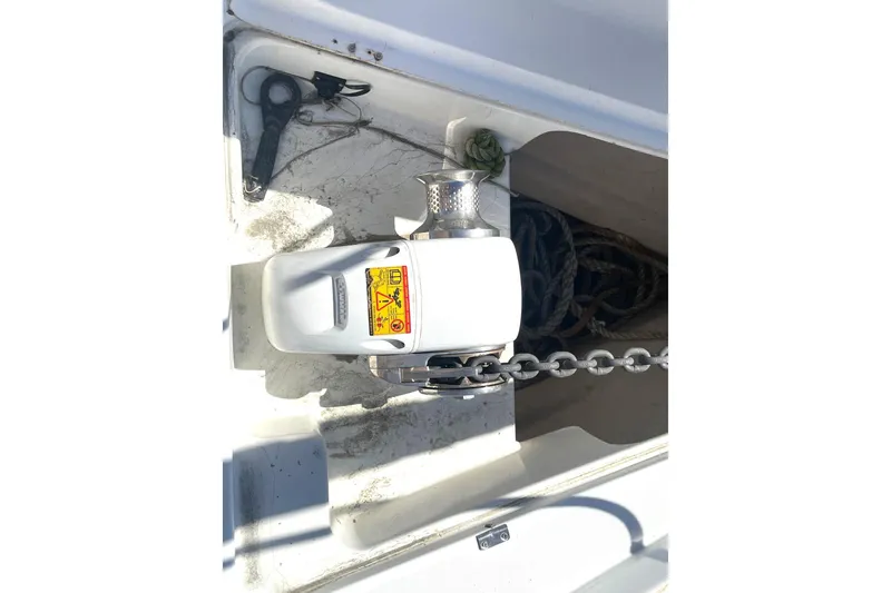 Slide: The Image of Anchor windlass on 2007 Beneteau 423 sailboat, with chain and rope storage. - 16