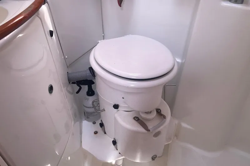 Slide: The Image of Compact marine toilet in a 2007 Beneteau 423 sailboat bathroom. - 22