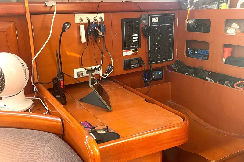 Slide: The Image of Navigation station on a 2007 Beneteau 423 sailboat with communication equipment. - 26