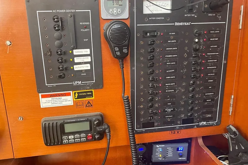 Slide: The Image of Electrical control panel on a 2007 Beneteau 423 sailboat, featuring various switches and gauges. - 27