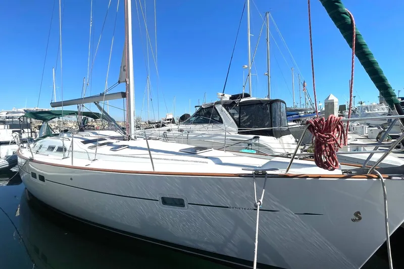 Slide: The Image of 2007 Beneteau 423 sailboat docked in marina under clear blue sky. - 3