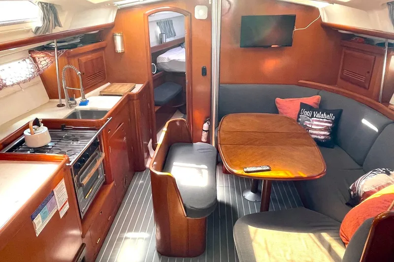 Slide: The Image of Interior of a 2007 Beneteau 423 yacht with kitchen and seating area. - 33