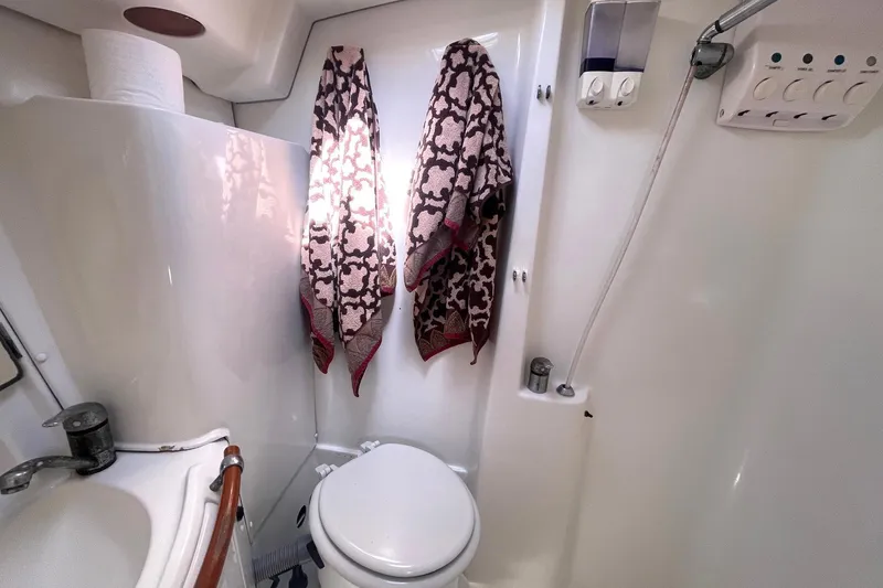Slide: The Image of Compact bathroom in a 2007 Beneteau 423 yacht with shower and towels. - 34