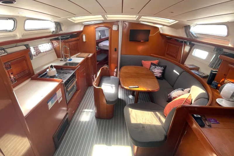 Slide: The Image of Luxurious interior of a 2007 Beneteau 423 yacht with cozy seating and modern amenities. - 35