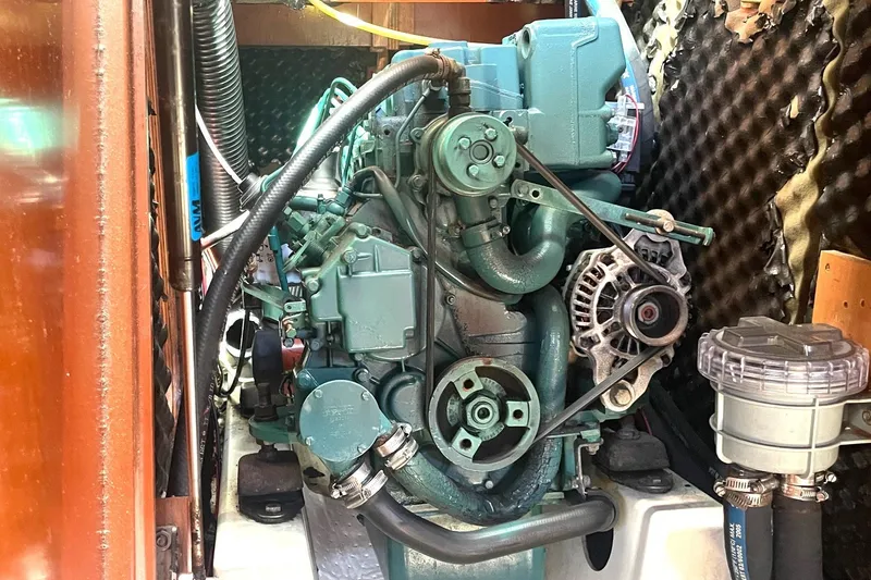 Slide: The Image of Engine compartment of a 2007 Beneteau 423 sailboat, showcasing mechanical components. - 39
